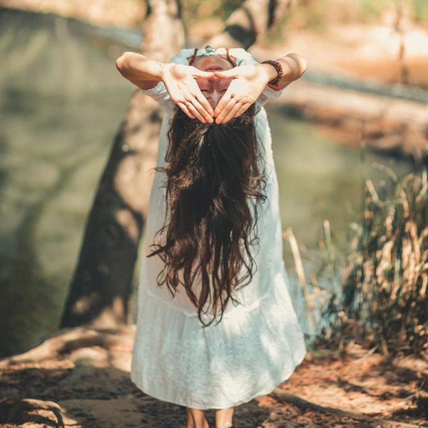 Person meditating peacefully in a bright, clean environment.